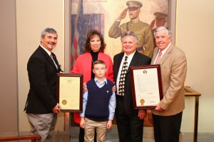 From left: State Rep. Steve Cookson, Gladys and Leroy Van Dyke with their grandson and Sen. Mike Parson stand in the Capitol.