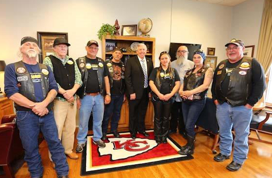 Freedom of Road Riders visit the Capitol on Wednesday. From left: Rick Greer, Troy Greer, Robert Ferraguti, Ken Kuszak, Senator Parson, Shayla Greer, Mark Witt, Becky Silvestro, and Bob Hawkins.