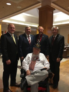 From Left to Right: Sen. Denny Hoskins, Lt. Gov. Mike Parsons, Rep. Charlie Davis and Sen. Wayne Wallingford meet a veteran at St. James Veterans Home.