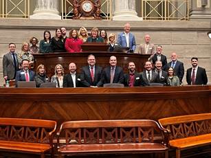 A group of people sitting at a podiumAI-generated content may be incorrect.