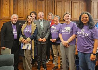 A group of people posing for a photoAI-generated content may be incorrect.