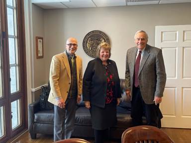 A group of people posing for a photoAI-generated content may be incorrect.