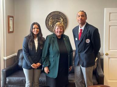 A group of people posing for a photoAI-generated content may be incorrect.