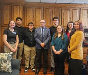 A group of people posing for a photoAI-generated content may be incorrect.