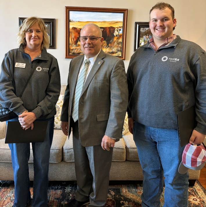 A group of men posing for a pictureAI-generated content may be incorrect.