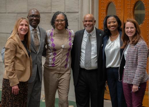 A group of people posing for a photoAI-generated content may be incorrect.