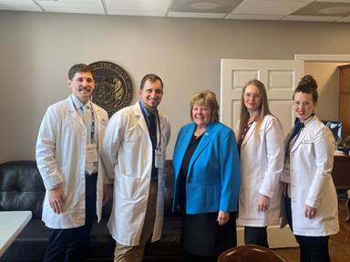 A group of people posing for a photoAI-generated content may be incorrect.